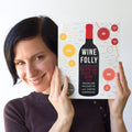 Madeline Puckette holds a copy of her first book: Wine Folly: The Essential Guide to Wine in 2015